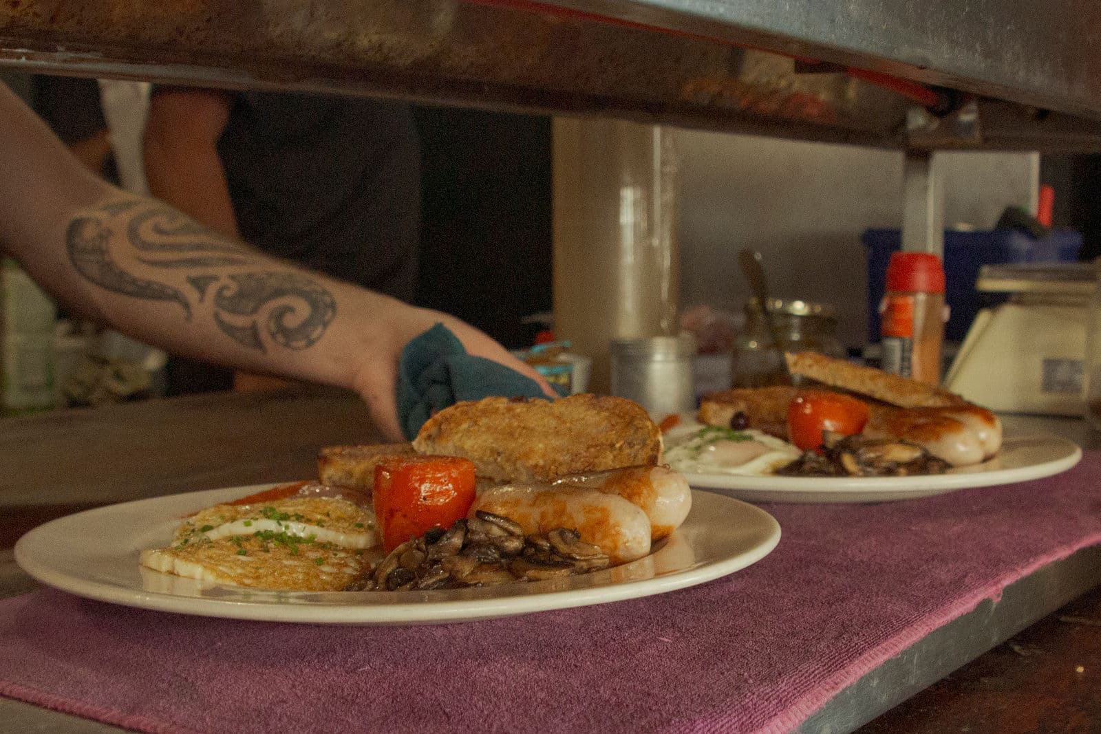 A cooked breakfast of eggs, sausage and toast at Empire Cafe